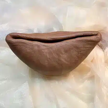 Make a pinch pot from clay ball