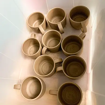 Mugs in damp box